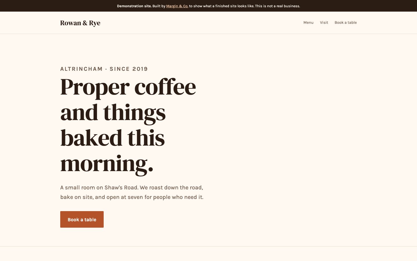 Rowan & Rye caf&eacute; homepage: cream page with a large serif headline reading Proper coffee and things baked this morning, and a terracotta Book a table button.